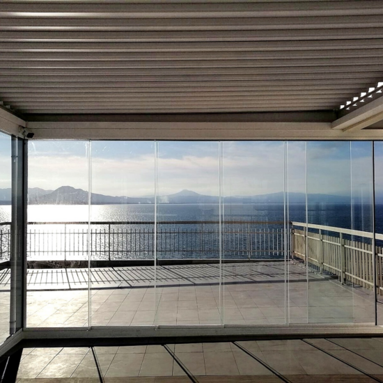 CospiEpal glass enclosure overlooking the sea