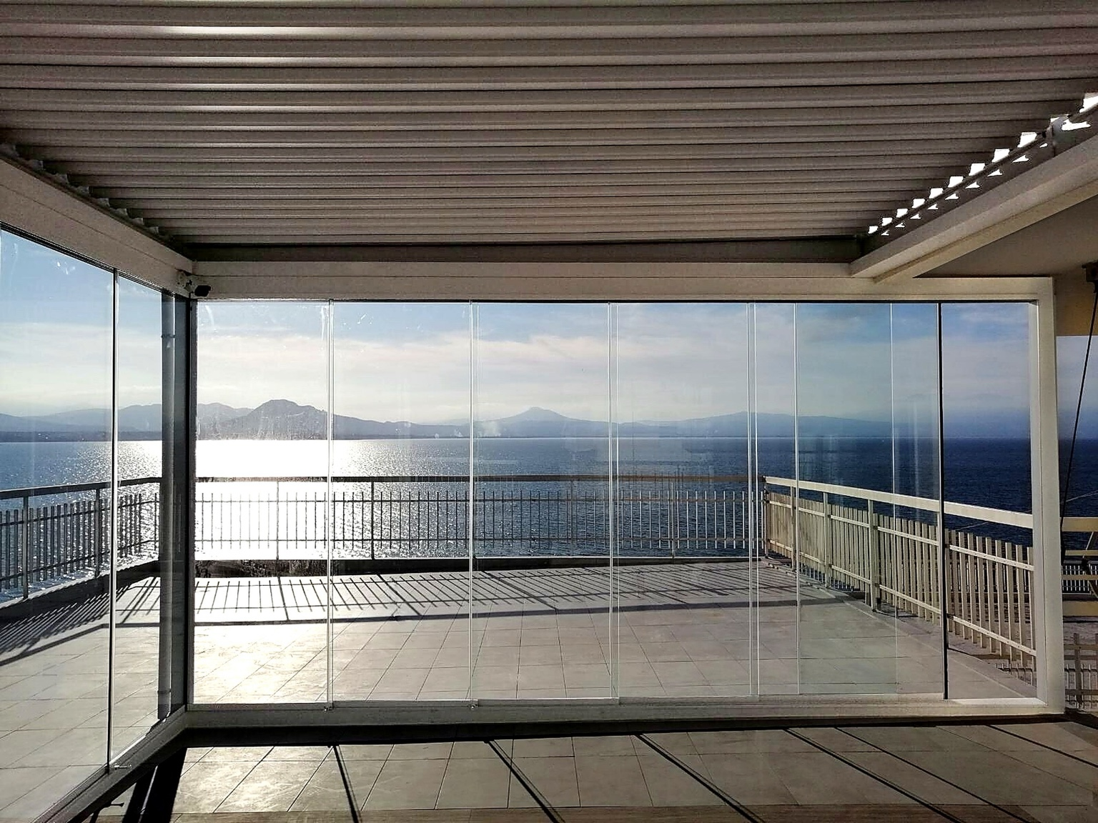 CospiEpal glass enclosure overlooking the sea